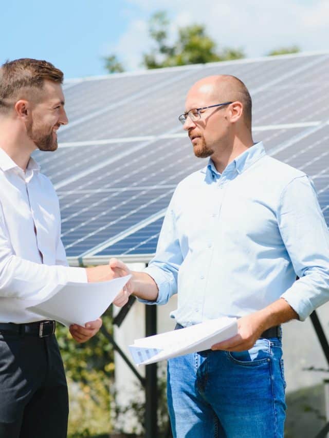 The solar farm(solar panel) with two engineers walk to check the operation of the system, Alternative energy to conserve the world's energy, Photovoltaic module idea for clean energy production