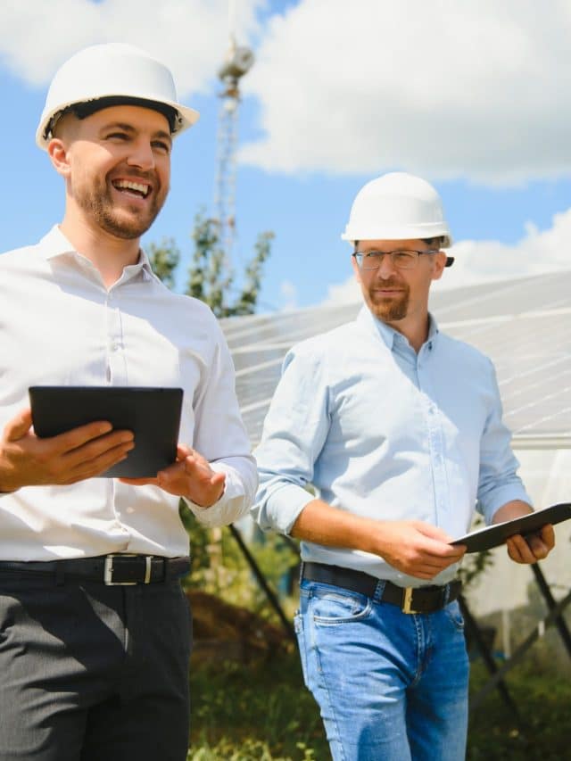 engineer and businessman planing new ecology project. around solar panel