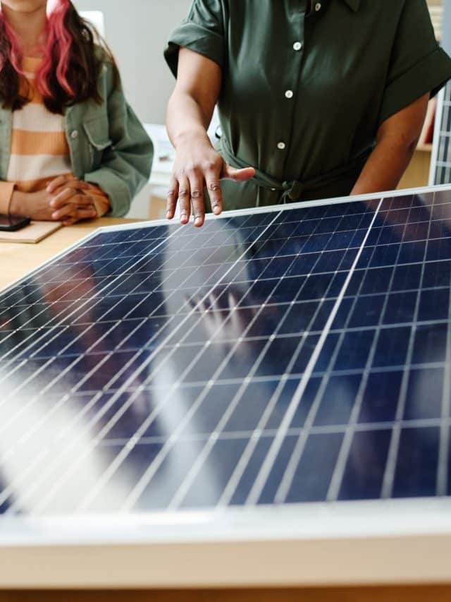Teacher showing the work of solar panel to students