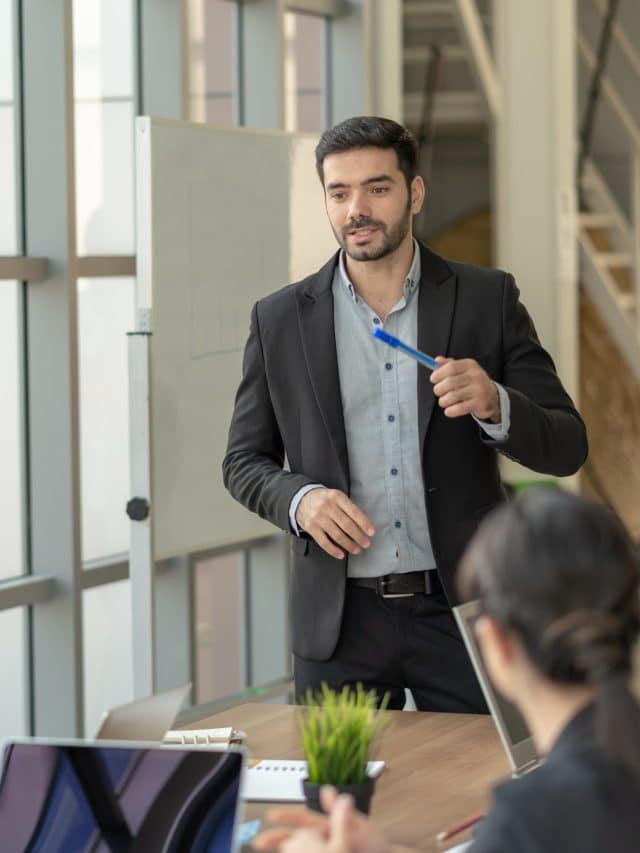 Businessman leader presenting to work while meeting wiht colleag