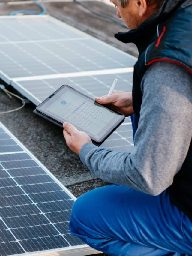 Solar energy engineer using tablet for check power station. Alternative energy system. eco concept