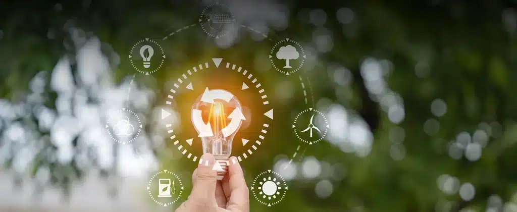 Lâmpada rodeada de ícones para artigo Atitudes para economizar energia e ajudar o meio ambiente