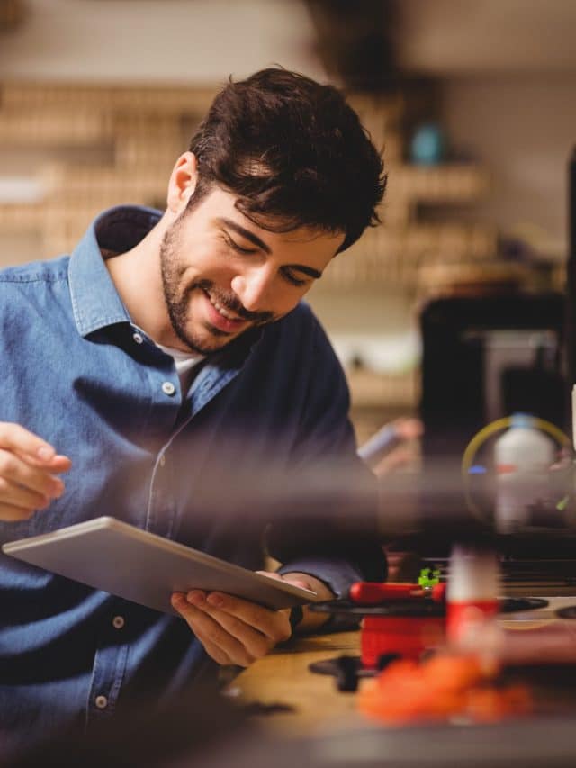 Graphic designer using digital tablet in office