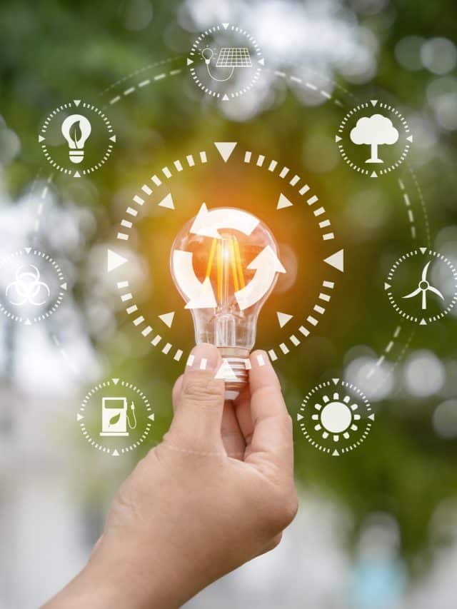 light bulb against nature, icons, green background for energy co