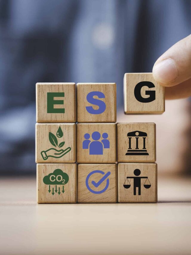 Businessman assemble ESG wording on wooden cube block for sustai