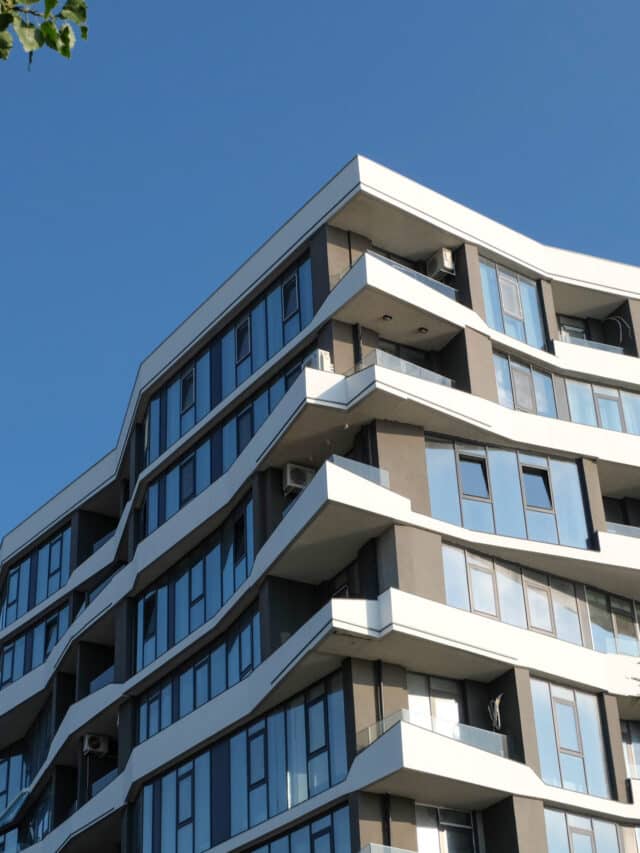 fragment-modern-building-against-blue-sky-real-estate