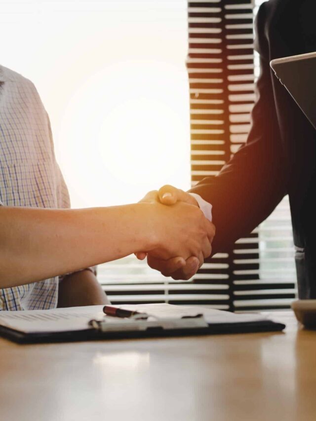 good-job-business-man-team-leader-suit-using-mobile-tablet-hands-shaking-with-young-employee