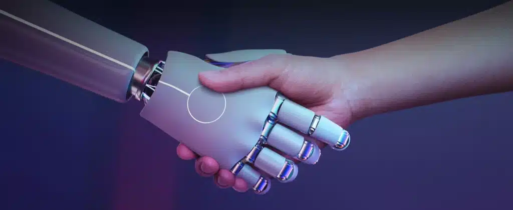 Robô e humano apertando as mãos para Inteligência artificial na indústria: entenda a importância