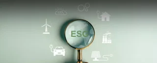 Lupa com sigla ESG e símbolos de sustentabilidade Como conseguir certificação ESG para sua empresa